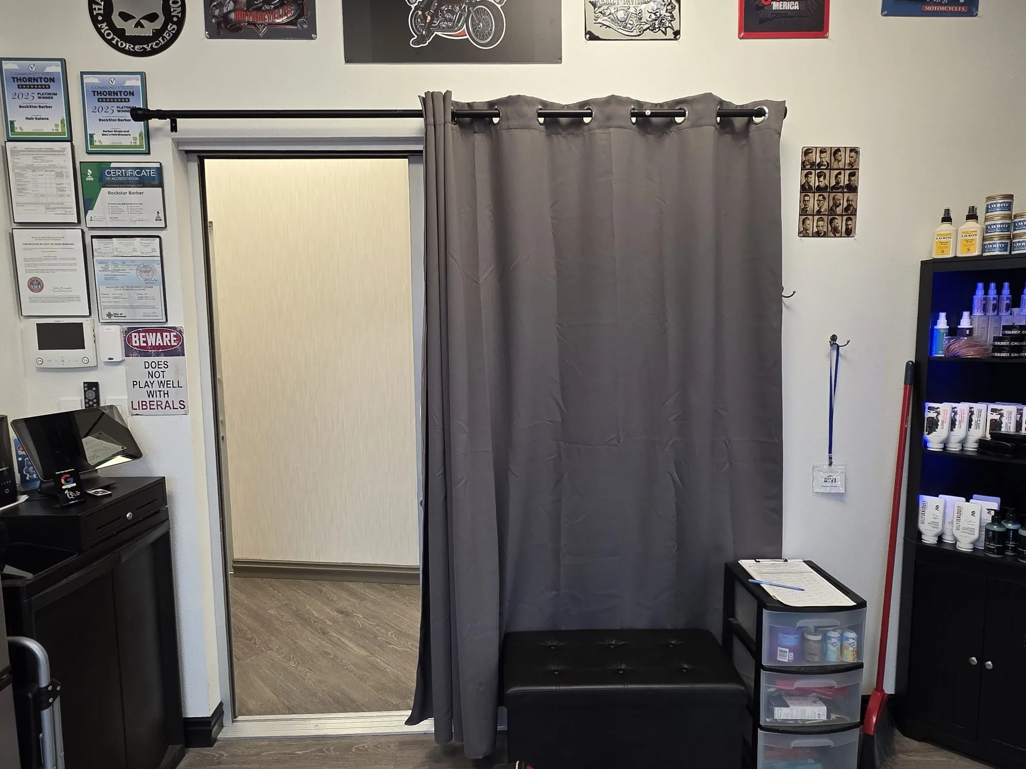 Entry and award wall inside RockStar Barber in Thornton