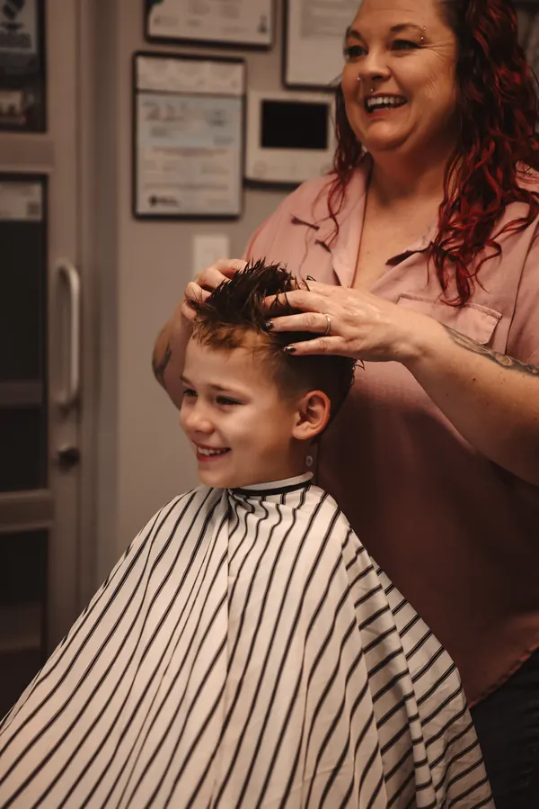 Young boy getting a haircut and styling at RockStar Barber