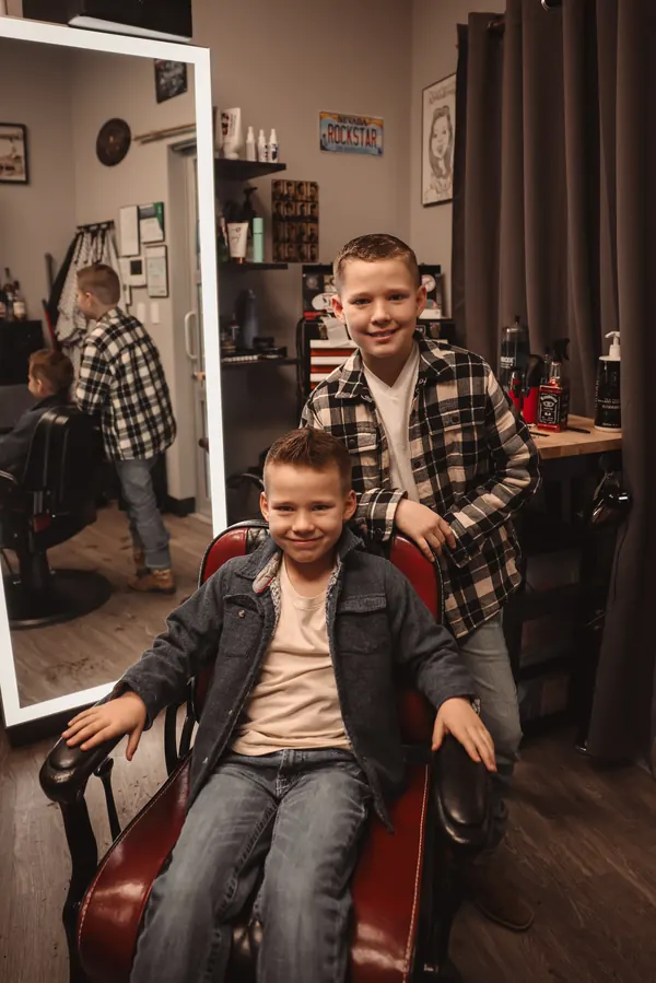Two brothers with fresh haircuts in the studio