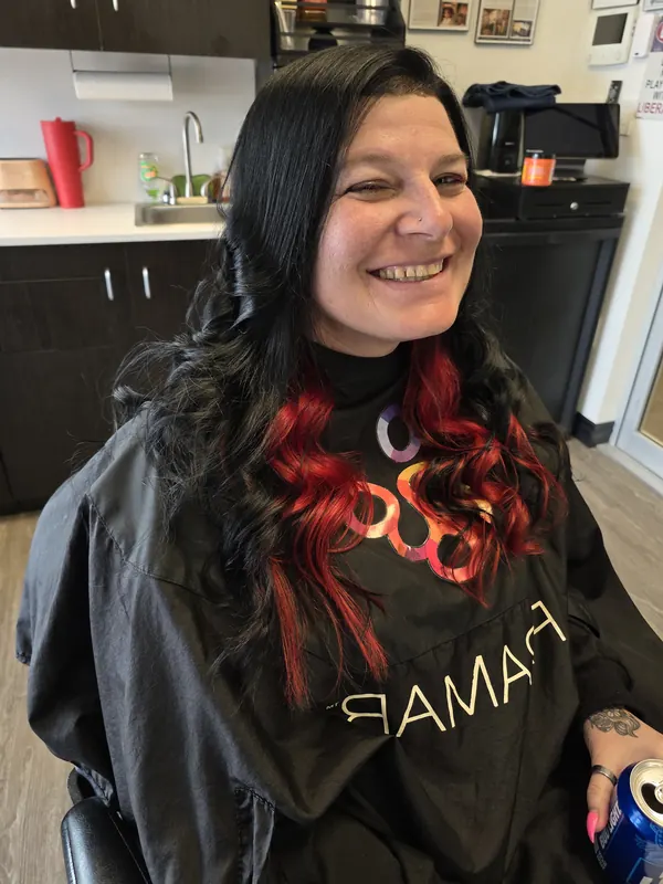Client with finished black and red color and curls