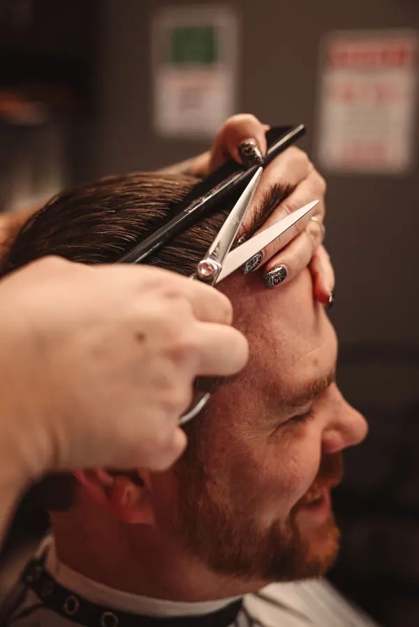 Scissor over comb haircut in progress at RockStar Barber